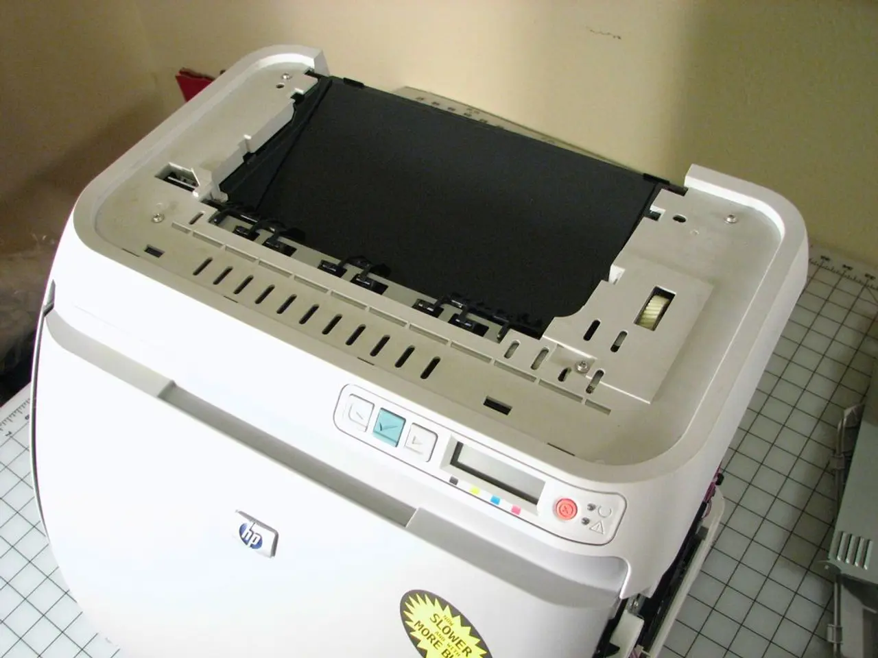 In this picture I can see a printer and an object on the cutting mat, and in the background there...