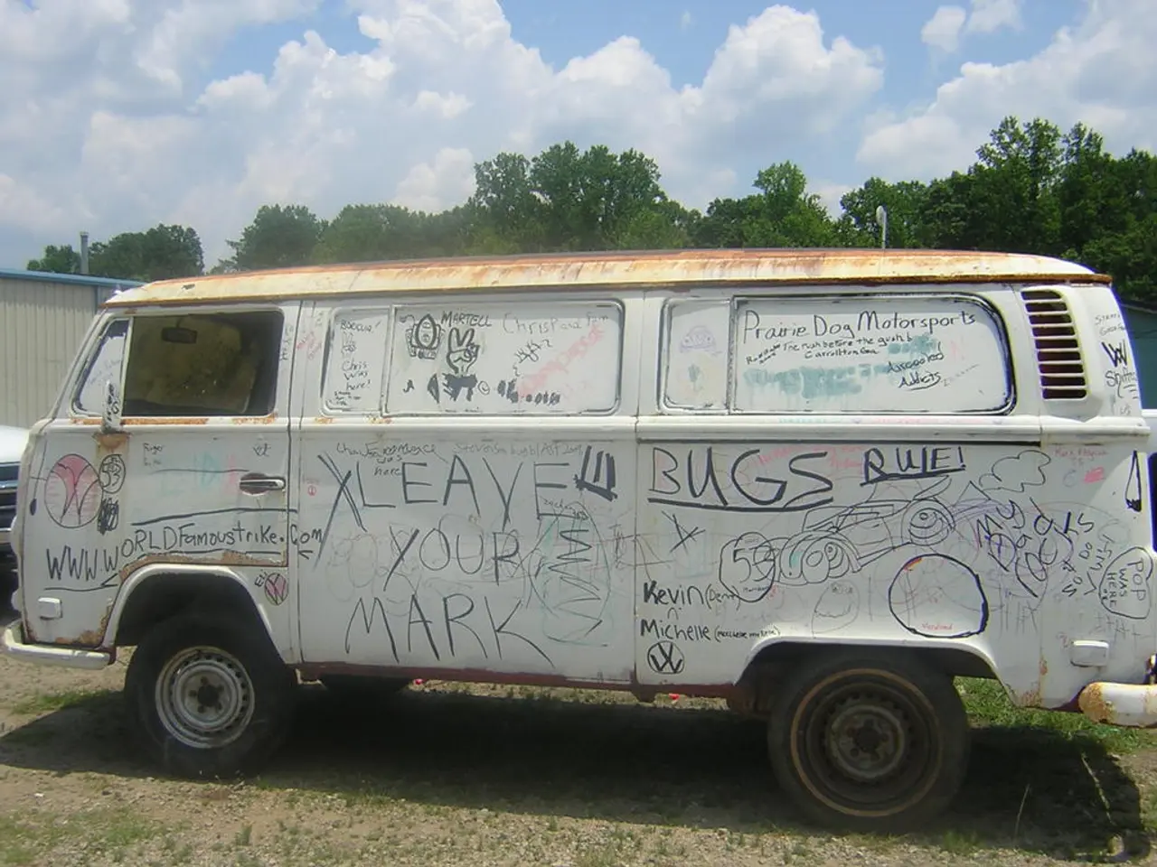 In the picture of there is a van and on the van there are some paintings and quotations are...
