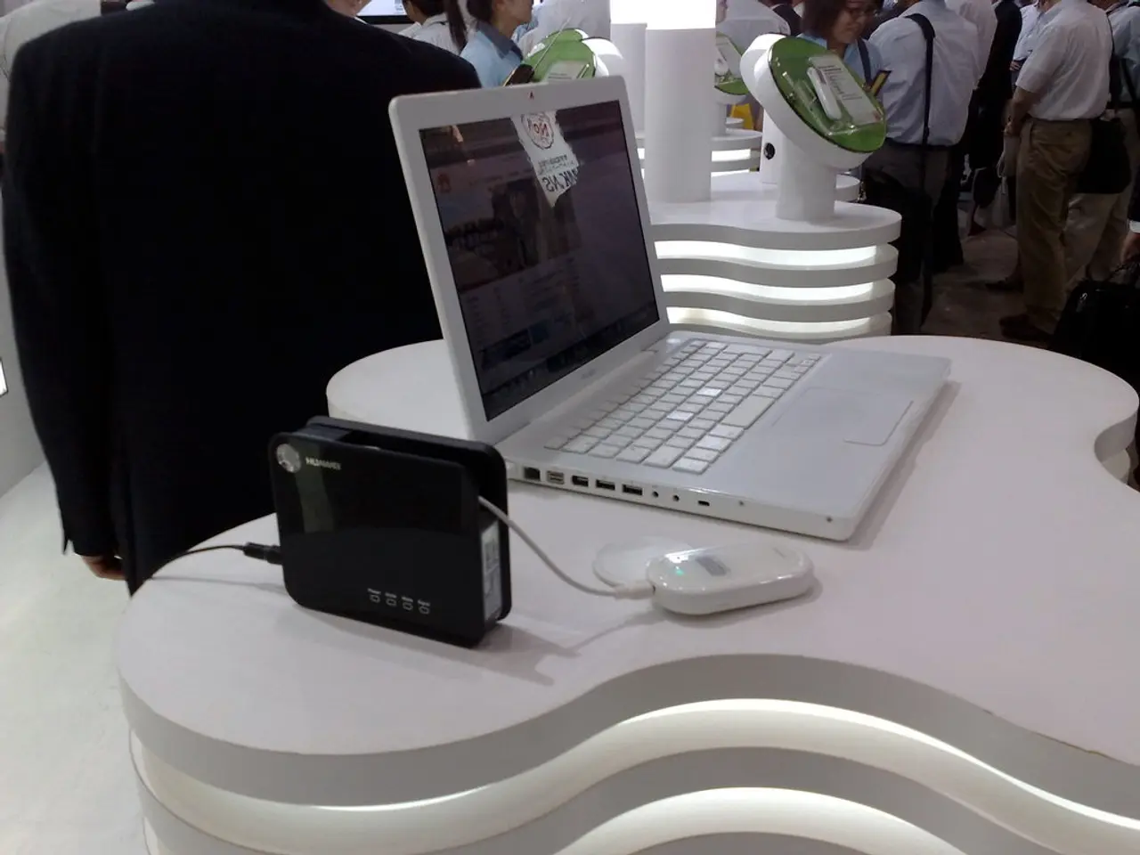 In this picture we can see a laptop and few devices on the platform and in the background we can...