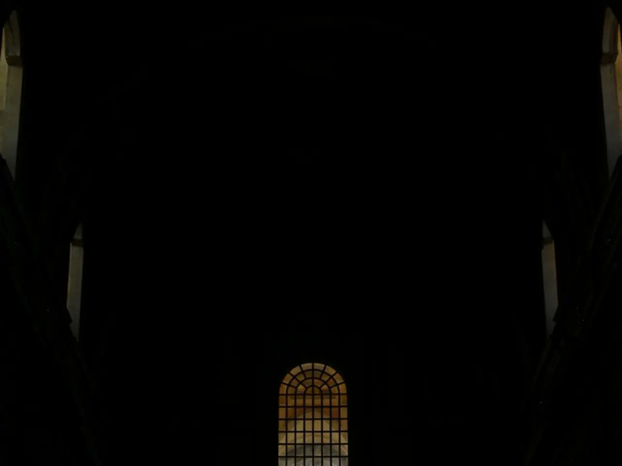 This is a dark image and we can see there are windows and a fence.