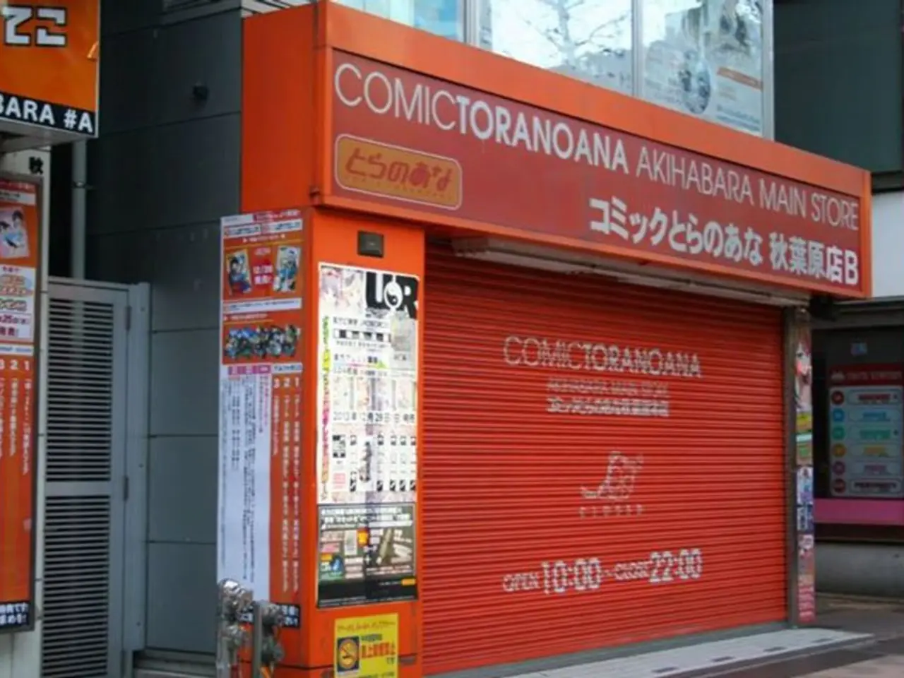 In this image there are buildings having few boards attached to it. Few posters are attached to the...