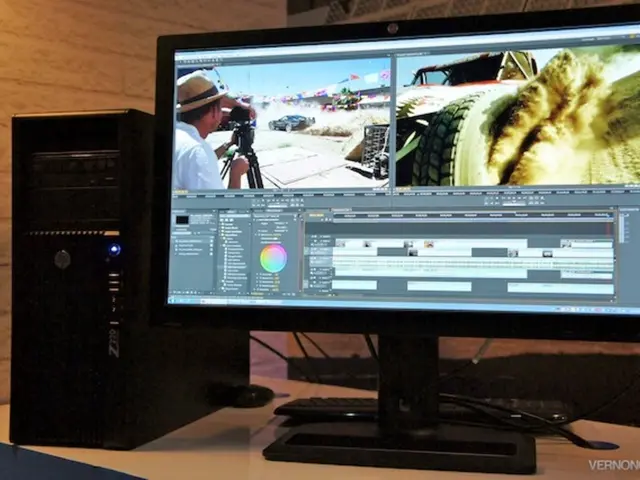 In this image there is a computer on the table. Beside it there is a CPU. In the background there...