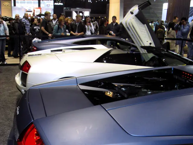 In this picture we can see so many cars are parked in one place, around the cars there is a belt...