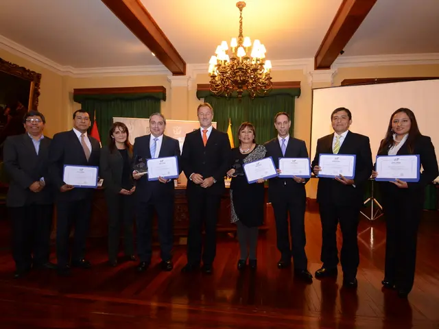 In this picture, we see six men and three women are standing. All of them are smiling and most of...