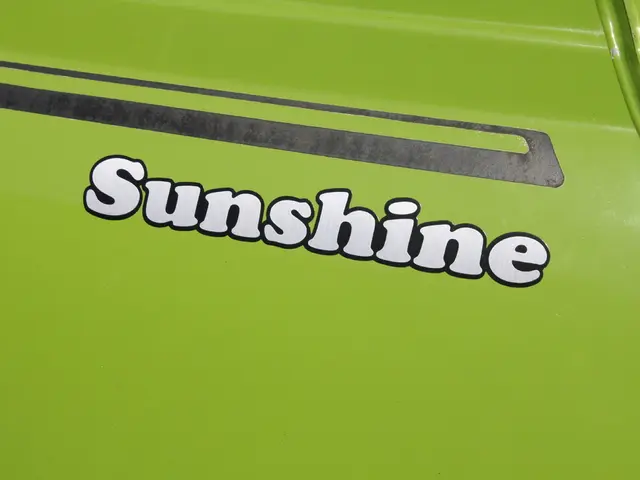 In this image we can see a vehicle which is in green color.