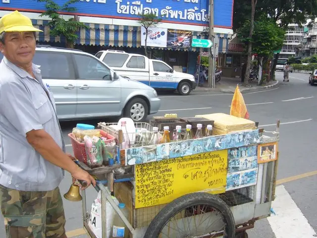 In this picture, we can see a few people, and among them a person is holding a wooden trolley with...