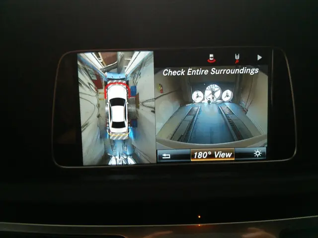 In this picture there is a phone in the center of the image, in which there is a car image, it...